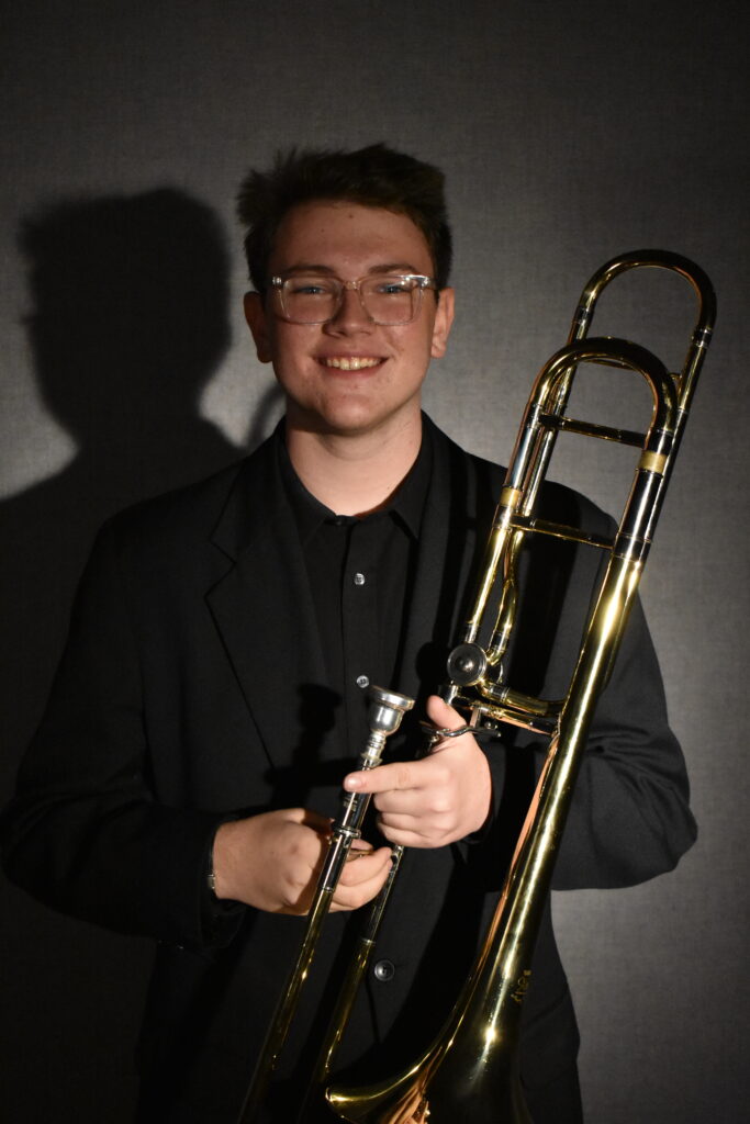Photo of David Miller holding his trombone